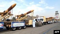 A handout photo provided by the Iranian Army media office Dec. 10, 2023, shows Iranian Karrar drones during their unveiling in Tehran.