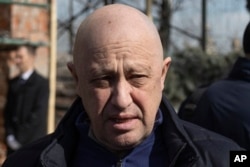 FILE - Yevgeny Prigozhin, the owner of the Wagner Group military company, arrives during a funeral ceremony at the Troyekurovskoye cemetery in Moscow, Russia, on April 8, 2023.