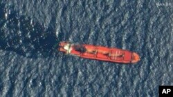 This satellite image taken by Maxar Technologies shows the Belize-flagged ship Rubymar in the Red Sea, March 1, 2024. 