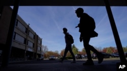 FILE - Students walk outside Upper Darby High School, Wednesday, April 12, 2023, in Drexel Hill, Pennsylvania. (AP Photo/Matt Slocum)