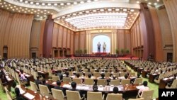 FILE - This picture taken April 12, 2020, shows a session of the Supreme People's Assembly, or North Korean parliament, at the Mansudae Assembly Hall in Pyongyang. (KCNA via AFP) 