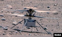This enhanced color image of NASA's Ingenuity Mars Helicopter was taken by the This enhanced color image of NASA's Ingenuity helicopter was taken by the Mastcam-Z instrument aboard Perseverance on April 16, 2023. (NASA/JPL-Caltech/ASU/MSSS)