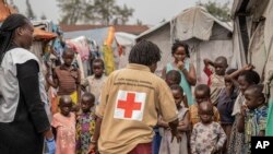 Red Cross officials create awareness of mpox in the Don Bosco refugee camp in Goma, Democratic Republic of the Congo, Aug. 22, 2023.