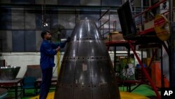 A man works on components for the Indian Space Research Organization at a facility of Godrej Aerospace in Mumbai, India, July 10, 2023. 