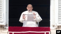 Pope Francis delivers the Angelus noon prayer from his studio's window overlooking St. Peter's Square at the Vatican, Jan. 14, 2024. 