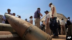 FILE - Cluster bomb units are displayed at a Lebanese military base in Nabatiyeh, Sept. 12, 2011. The Biden administration said July 7, 2023, that it would provide cluster munitions to Ukraine in the latest military aid package for the war against Russia.