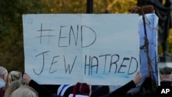 FILE - An Israeli supporter takes part in a protest where placards with the faces and names of people believed taken hostage and held in Gaza were held up during a protest in Trafalgar Square, London, on Oct. 22, 2023.