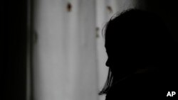  A 26-year-old woman, who declined to give her name for security reasons, speaks in safe house for women in Belgrade, Serbia, Nov. 23, 2023. 