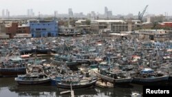 Anchored fishing boats after ban imposed on coastal activities following the Cyclone Biparjoy, over the Arabian Sea, at Karachi's Fish Harbor, in Karachi, Pakistan, June 10, 2023.