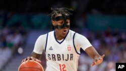 FILE - Yvonne Anderson, of Serbia, dribbles in a women's basketball game against Puerto Rico at the 2024 Summer Olympics, in Villeneuve-d'Ascq, France, July 28, 2024.