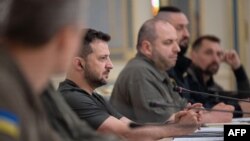 This handout photo released by Ukraine's Presidential Press Service on Sept. 28, 2023, shows Ukrainian President Volodymyr Zelenskyy (2nd L) and Defense Minister Rustem Umerov (3rd L) meeting with a French defense ministry delegation in Kyiv. 