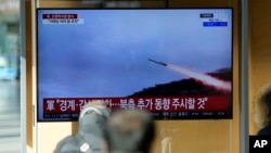A TV screen shows file footage of a North Korean cruise missile during a news program at the Seoul Railway Station, in Seoul, South Korea, Jan. 24, 2024.
