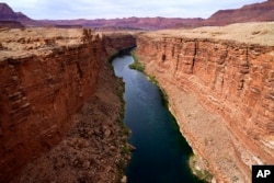 FILE - The Colorado River in the upper River Basin is pictured in Lees Ferry, Arizons, May 29, 2021.