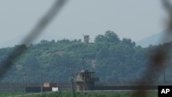 A North Korean military guard post, background, and a South Korean post, front, are seen in Paju South Korea, Thursday, July 20, 2023. (AP Photo/Ahn Young-joon)
