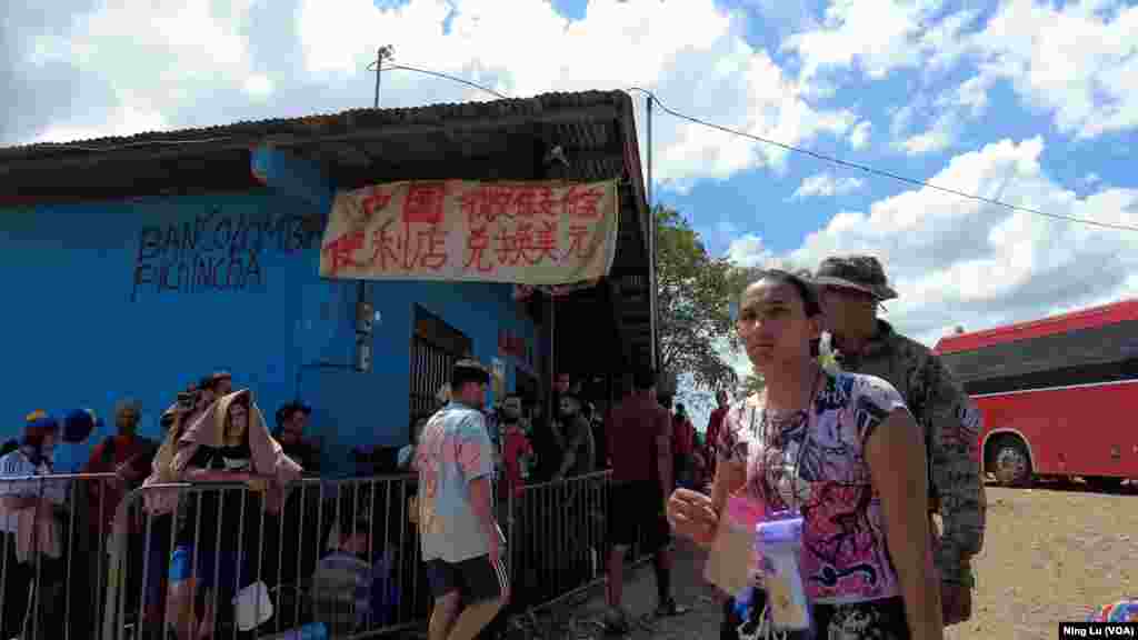 A sign outside a convenience store in Lajas Blancas, Darien Province, Panama, on Feb. 24, 2024, says, &ldquo;Chinese convenience store, money exchange with WeChat Pay or Zhifubao.&quot;