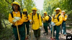 Wildland firefighter students from Alabama A&M and Tuskegee universities listen during a wildland firefighter training, June 9, 2023, in Hazel Green, Alabama.