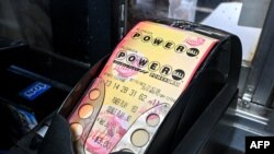 FILE - Powerball lottery tickets are pictured inside a store in Homestead, Florida, July 19, 2023. 