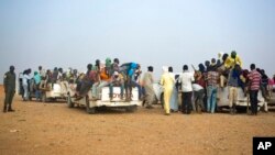 FILE - Nigeriens and third-country migrants head toward Libya from Agadez, Niger, June 4, 2018. Niger's junta has revoked a 2015 anti-migration law that had helped reduce the flow of West Africans to Europe.