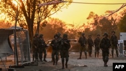 Israeli soldiers patrol Oct. 12, 2023, near Kibbutz Beeri, where 270 revelers were killed by Hamas militants during the Supernova music festival on Oct. 7.