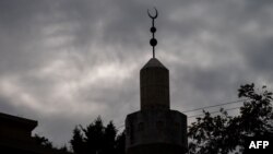 The crescent moon is displayed above Dar Al Hijrah Islamic Center in Falls Church, Va., on Oct. 31, 2023.