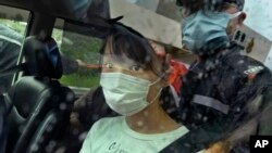 FILE - Agnes Chow, a prominent pro-democracy activist who was sentenced to 10 months in jail in November 2020 over an unauthorized assembly charge, is released, in Hong Kong, June 12, 2021. 