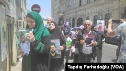 Həbsdə olan inanclı insanlarıaksiyası (Arxiv foto. Mənbə: VOA)