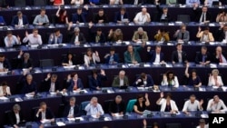 FILE - Lawmakers vote on the Artificial Intelligence act Wednesday, June 14, 2023 at the European Parliament in Strasbourg, eastern France.