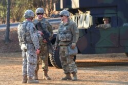 FILE - U.S. soldiers stand guard during a joint medical evacuatioin exercise at a South Korean Army hospital in Goyang, northwest of Seoul, March 15, 2017.