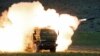 A launch truck fires the High Mobility Artillery Rocket System (HIMARS) during training at the Yakima Training Center, Washington State, USA, on May 23, 2011 (Tony Overman, AP)