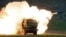 A launch truck fires the High Mobility Artillery Rocket System (HIMARS) during training at the Yakima Training Center, Washington State, USA, on May 23, 2011 (Tony Overman, AP)