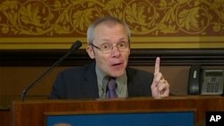 FILE - In this image taken from a video, economist Sean Turnell speaks at the Lowy Institute in Sydney, Australia, Nov. 28, 2013. The Myanmar junta has revoked its pardon of Turnell, who was granted amnesty and deported last November.