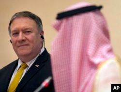 FILE - U.S. Secretary of State Mike Pompeo, left, listens to Saudi Arabia's Foreign Minister Adel al-Jubeir, during a joint press conference at the Royal Terminal of King Khaled airport, in Riyadh, Saudi Arabia, April 29, 2018.