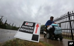 A man in a wheel chair leaves an evacuation shelter as Hurricane Harvey descends on parts of southern Texas, in San Antonio, Texas, Aug. 26, 2017.