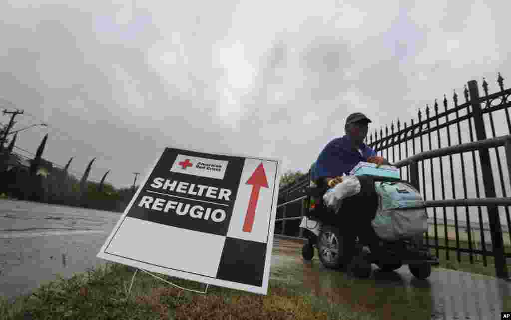 A man in a wheel chair leaves an evacuation shelter as Hurricane Harvey descends on parts of southern Texas, in San Antonio, Texas, Aug. 26, 2017. 