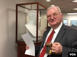 Longtime Republican Morton Blackwell walks by a Carrara marble bust of President Ronald Reagan. Blackwell had it commissioned for his Leadership Institute. Blackwell says he thinks Republicans will need more than money to fare well in the 2018 midterm elections. (C. Presutti/VOA)
