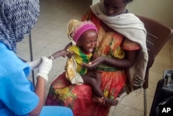 Medhin Gereziher, 1, is treated for malnutrition at the Ayder Referral Hospital in Mekele, in the Tigray region of northern Ethiopia, Oct. 4, 2022.