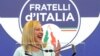 FILE - Brothers of Italy leader Giorgia Meloni speaks to reporters at her party's electoral headquarters in Rome, Sept. 26, 2022.