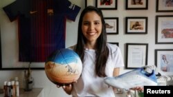 Paraguayan artist Lili Cantero, 29, poses for a photograph while showing her work, in San Lorenzo, Paraguay October 15, 2022. (REUTERS/Cesar Olmedo)