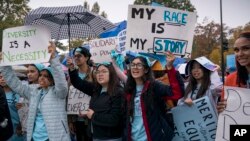FILE - Students and activists rally outside the Supreme Court as the court before oral arguments in two cases that could decide the future of affirmative action in college admissions, Monday, Oct. 31, 2022, in Washington. (AP Photo/J. Scott Applewhite)