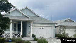The homes at Babcock Ranch were designed to withstand hurricane-force winds. They sustained practically no damage during Hurricane Ian on Sept. 28, 2022, which brought winds over 160 kph. At right, a few shingles were torn off the roof of a garage. (Courtesy Babcock Ranch)