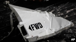 FILE - Debris from the missing Air France flight 447 is put on display for the media after being recovered during search operations, at Recife's Air Force base, Brazil, June 12, 2009.