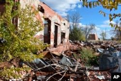 The ruins of a building that was part of a Native American boarding school on the Rosebud Sioux Reservation in Mission, S.D., are seen on Saturday, Oct. 15, 2022.