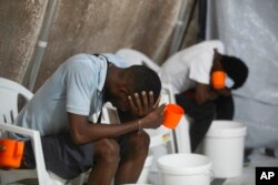 FILE - Patients with cholera symptoms sit in an observation center at a cholera clinic run by Doctors Without Borders in Port-au-Prince, Haiti, Oct. 7, 2022.