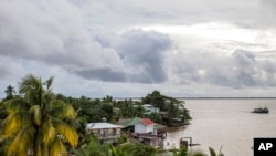 FILE - A boat arrives in Bluefields Bay, on the Caribbean coast of Nicaragua, July 2, 2022. Forecasters said Oct. 7, 2022, that Tropical Storm Julia had formed off the coast of Colombia and that it was on a westward path toward Nicaragua.