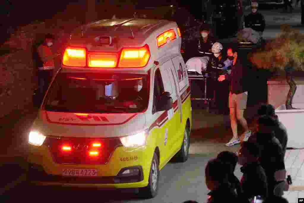 A body is transported on a stretcher to be loaded into an ambulance at Soonchunhyang University Hospital in Seoul, South Korea, Oct. 30, 2022. 