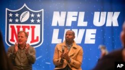 NFL Commissioner Roger Goodell, left, and Osi Umenyiora attend the International Series Fan Forum in London, Oct. 8, 2022.
