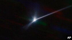 This image made available by NOIRLab shows a plume of dust and debris blasted from the surface of the asteroid Dimorphos by NASA's Dart spacecraft after it impacted on Sept. 26, 2022, captured by the U.S. National Science Foundation's NOIRLab's SOAR telescope in Chile. 