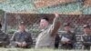 FILE - This picture taken Oct. 8, 2022, and released by North Korea's official Korean Central News Agency Oct. 10, 2022, shows North Korean leader Kim Jong Un, center, attending an air attack training exercise for the Korean People's Army Air Force at an undisclosed location.