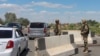 Uzbek service members guard a road in Nukus, capital of the northwestern Karakalpakstan region, Uzbekistan, July 6, 2022. 