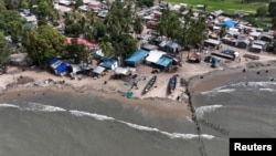 Wooden structures using the Maltais-Savard Ears System that is used to limit the erosion of the shoreline, in Diogue island, Senegal July 14, 2022. (REUTERS/Zohra Bensemra)